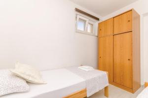 Postel nebo postele na pokoji v ubytování Apartments Toni