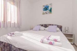 Postel nebo postele na pokoji v ubytování Apartments Toni