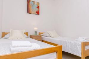 Postel nebo postele na pokoji v ubytování Apartments Toni