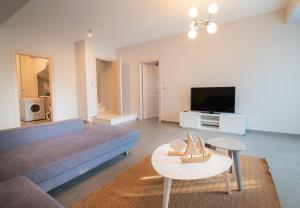 A television and/or entertainment centre at Bellevue Villas with private pool