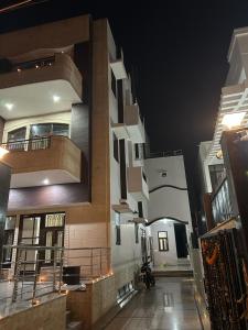 a view of a building at night at RAJ RESIDENCY in Gurgaon