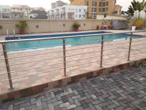 a swimming pool on top of a building at St Theresa apartment Lodge in Lagos