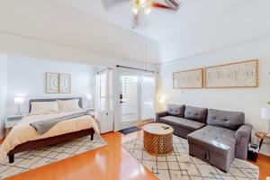 a bedroom with a bed and a couch at Restful City Living, Unit B in Dallas