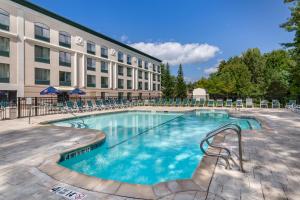 a large swimming pool in front of a building at Comfort Inn & Suites in Lake George