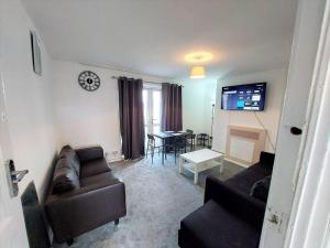 TV a/nebo společenská místnost v ubytování 3 bedroom Flat in Hoxton London