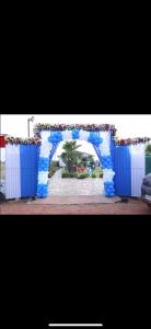 a blue arch with an archway in a park at MB farms in Greater Noida