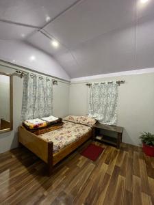 Postel nebo postele na pokoji v ubytování Pakha Dhim Homestay Namchi