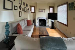 a living room with a couch and a fireplace at Wallingford Heights in Seattle