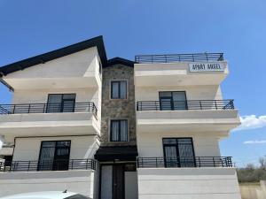 a white building with a sign that reads farm market at Apart Angel Suit 5 in Nevsehir