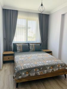 a bedroom with a bed in front of a window at Apart Angel Suit 5 in Nevsehir