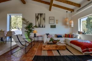 a living room with a couch and a coffee table at Naraya - Managed By Almarina Villas in Jávea +91 photos