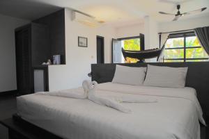 Giường trong phòng chung tại Prana Hotel