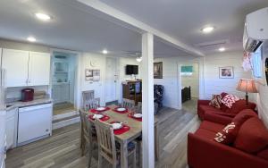 a living room with a red couch and a table at Kanab Vacation Destination in Kanab