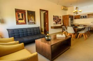 a living room with a couch and a table at Mesón de la Luna Hotel & Spa in Mérida