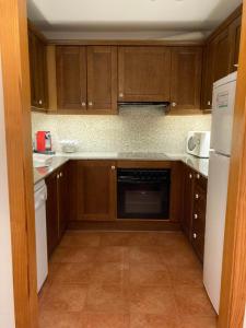 Kuchyň nebo kuchyňský kout v ubytování Apartament Vall
