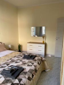 Postel nebo postele na pokoji v ubytování Civita Home Experience