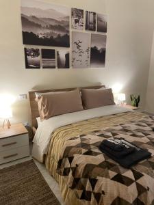 Postel nebo postele na pokoji v ubytování Civita Home Experience