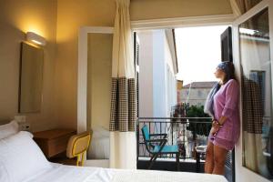 A bed or beds in a room at Athena hotel