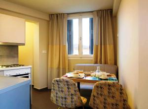 A kitchen or kitchenette at Athena hotel