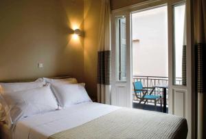 A bed or beds in a room at Athena hotel