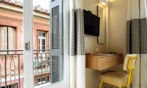 A television and/or entertainment centre at Athena hotel
