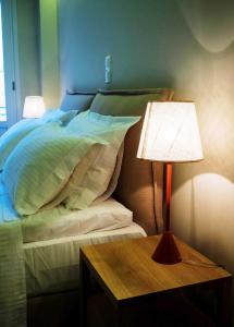 A bed or beds in a room at Athena hotel