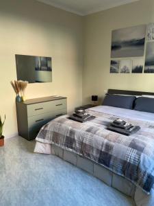 Postel nebo postele na pokoji v ubytování Civita Home Experience