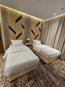 Postel nebo postele na pokoji v ubytování فندق سي قل - Sea gull Hotel