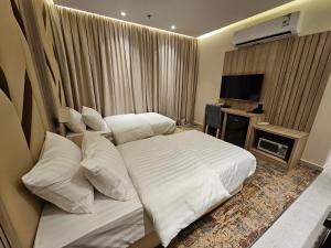 Postel nebo postele na pokoji v ubytování فندق سي قل - Sea gull Hotel
