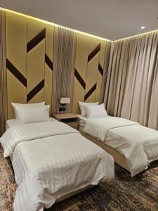 Postel nebo postele na pokoji v ubytování فندق سي قل - Sea gull Hotel