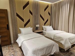 Postel nebo postele na pokoji v ubytování فندق سي قل - Sea gull Hotel