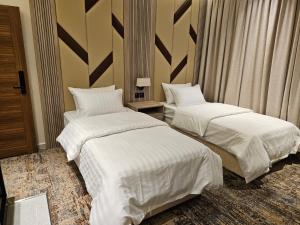 Postel nebo postele na pokoji v ubytování فندق سي قل - Sea gull Hotel