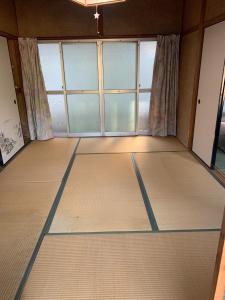 an empty room with a large window in a room at J's Select & Lodge - Vacation STAY 16052 in Kumano