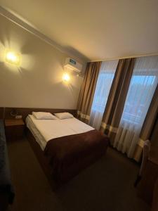 Posteľ alebo postele v izbe v ubytovaní Hotel Sofiivka
