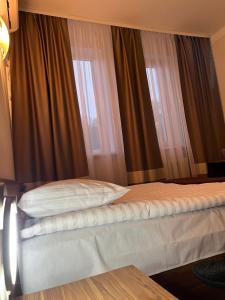 Posteľ alebo postele v izbe v ubytovaní Hotel Sofiivka