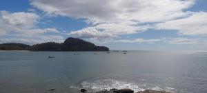 a large body of water with boats in it at Hostal Pelican in El Gigante +2 photos