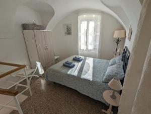 Posteľ alebo postele v izbe v ubytovaní La Casa degli Alberi