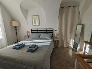 Posteľ alebo postele v izbe v ubytovaní La Casa degli Alberi