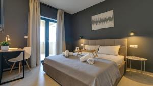a bedroom with a large bed with a table on it at Villa Amoroso by Villas Holiday in Nova Vas +32 photos