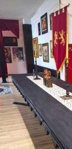 a long black table with a flag on it at Galeria Design Art in Florianópolis