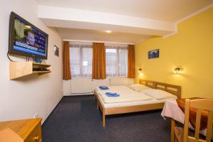 Ένα ή περισσότερα κρεβάτια σε δωμάτιο στο Hotel Helena