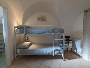 Posteľ alebo postele v izbe v ubytovaní La Casa degli Alberi