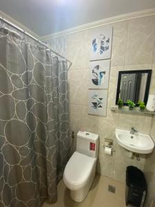 a bathroom with a toilet and a sink at Kege's Pad - 2 Bedroom Townhouse near Clark Airport & Aqua Planet - TRP8 in Mining +19 photos