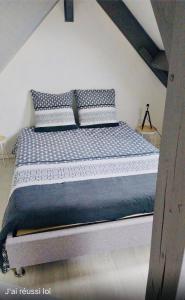 Кровать или кровати в номере L'Atelier Cosy