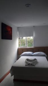 Uma cama ou camas num quarto em Hotel Bayadera Real