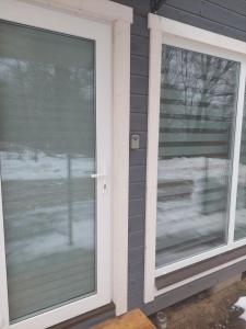 a window with blinds on a house at Gravas mala in Sigulda