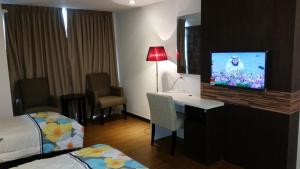 Et tv og/eller underholdning på Kota Bharu Apartment