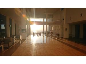 an empty room with chairs and tables in a building at Shonan Relief - Vacation STAY 51630v in Yokosuka