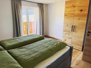 Кровать или кровати в номере Apartment Tanzberger