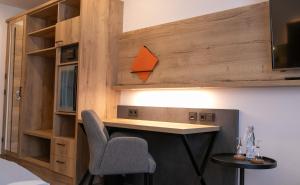 a room with a desk and a chair at Landhaus Rhönblick in Künzell +14 photos